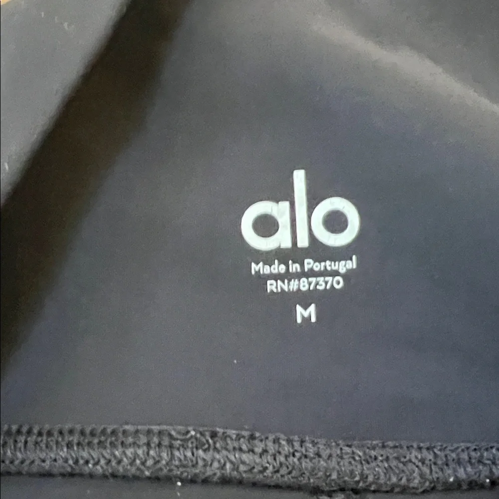 ALO Yoga black ripped high waist warrior leggings.